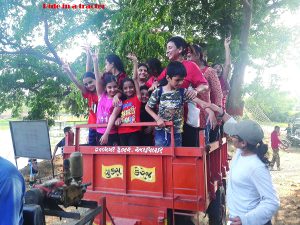 Kids having a thrilling tractor ride
