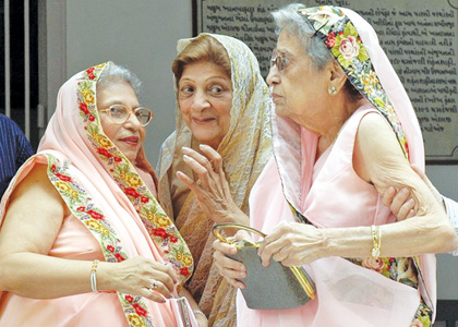 Indian members of the Parsi community are jubilant on Navroz, the Parsi New Year at the Parsi Fire Temple in Hyderabad, 20 August 2007. Parsis are Zoroastrians who arrived in India 1200 years ago from Persia, fleeing persecution at the hands of Arab conquerors invading Persia. Despite their meagre numbers, the Parsi community has played a large role in the development of the country. AFP PHOTO / NOAH SEELAM (Photo credit should read NOAH SEELAM/AFP/Getty Images)