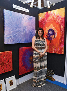 Natasha Lalla displays her art at the exhibition