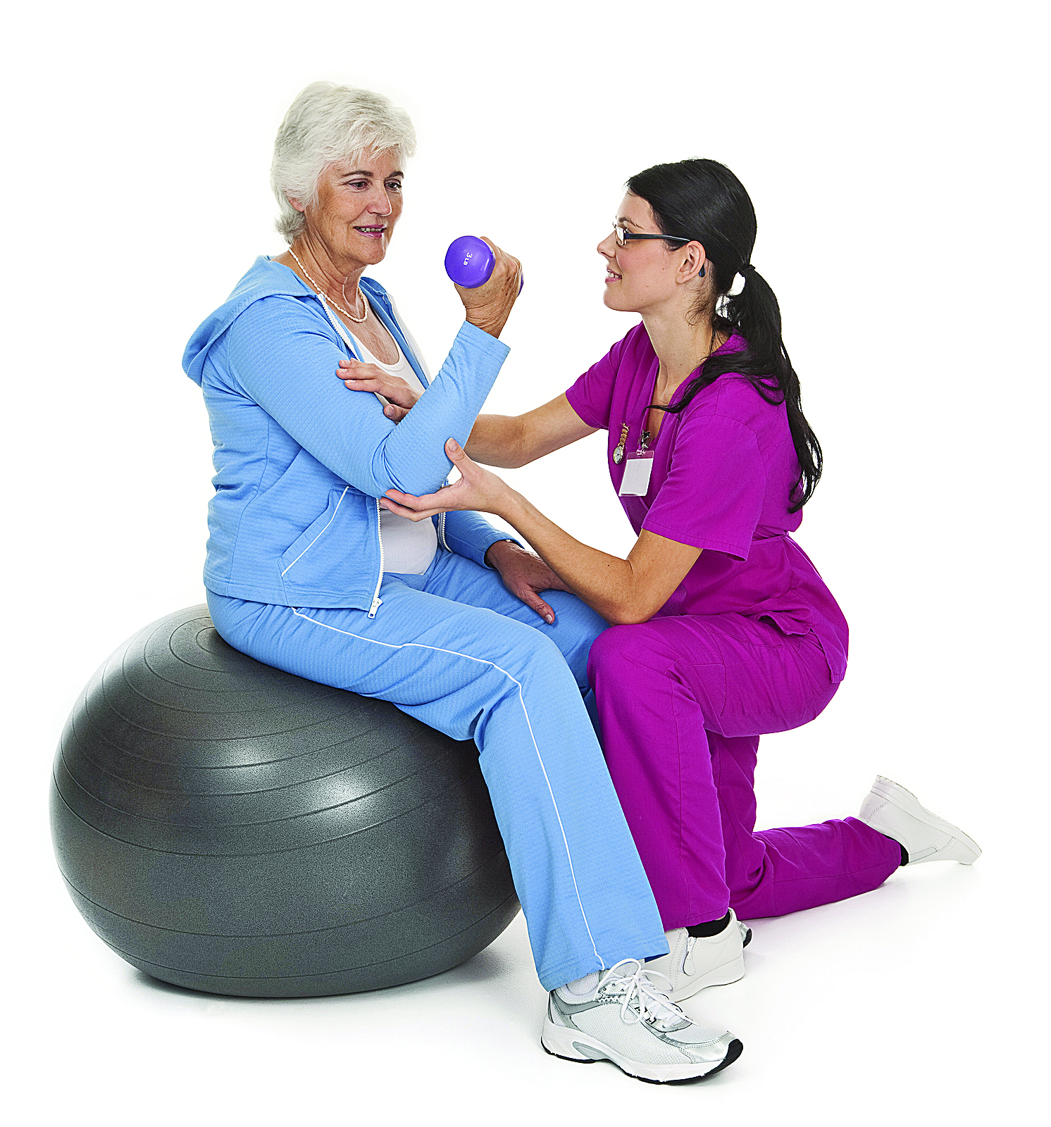 Female health care professional assisting female senior citizen with exercise technique.
